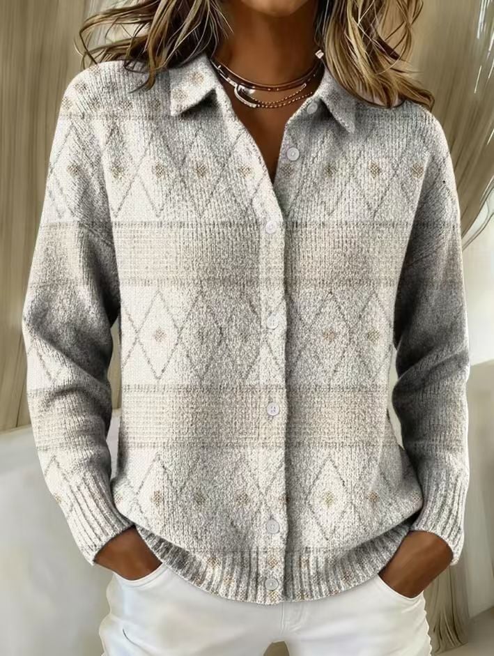 Woman wearing the Marigold elegant blouse in light gray, featuring a tailored silhouette and subtle detailing