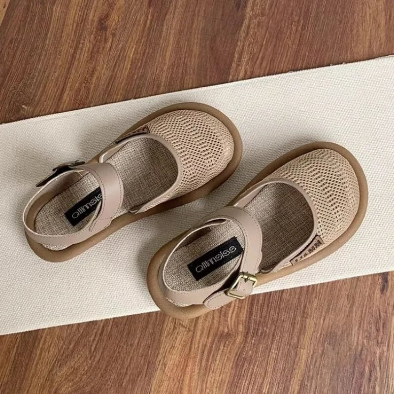 Overhead flat-lay of all three Marigold sandal colors: black, khaki, and white