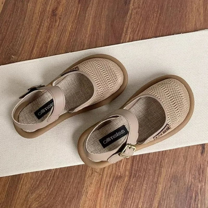 Overhead flat-lay of all three Marigold sandal colors: black, khaki, and white