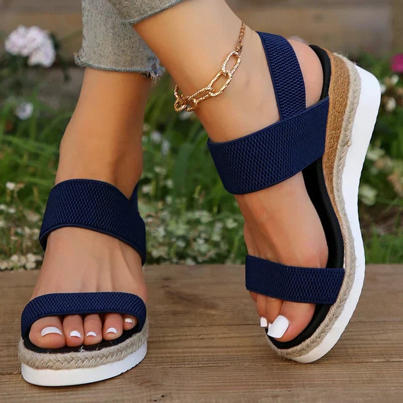 Close-up of Marigold sandal pink colorway highlighting adjustable buckle strap detail