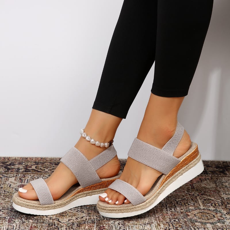Marigold orthopedic sandal in black against a neutral background