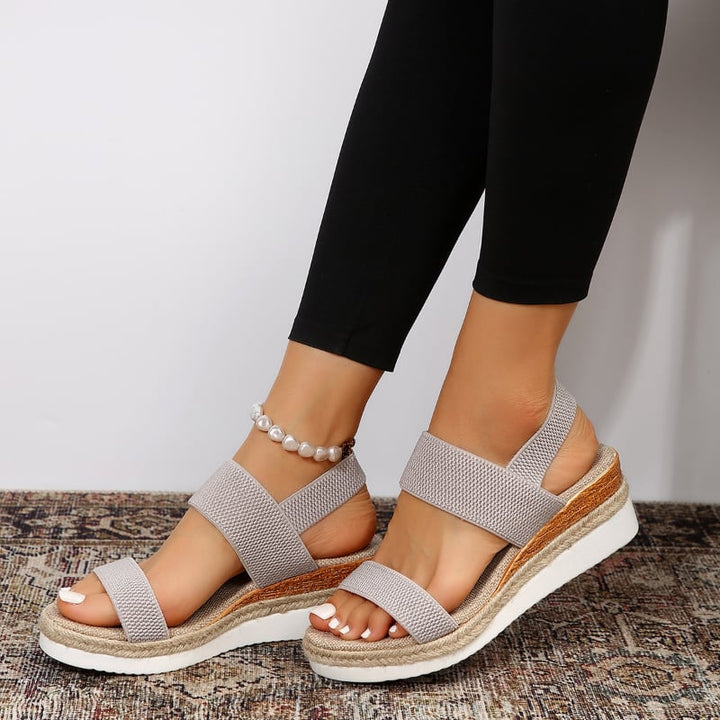 Marigold orthopedic sandal in black against a neutral background