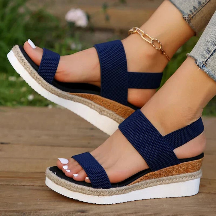 Overhead flat-lay of Marigold sandal in black showing contoured footbed construction