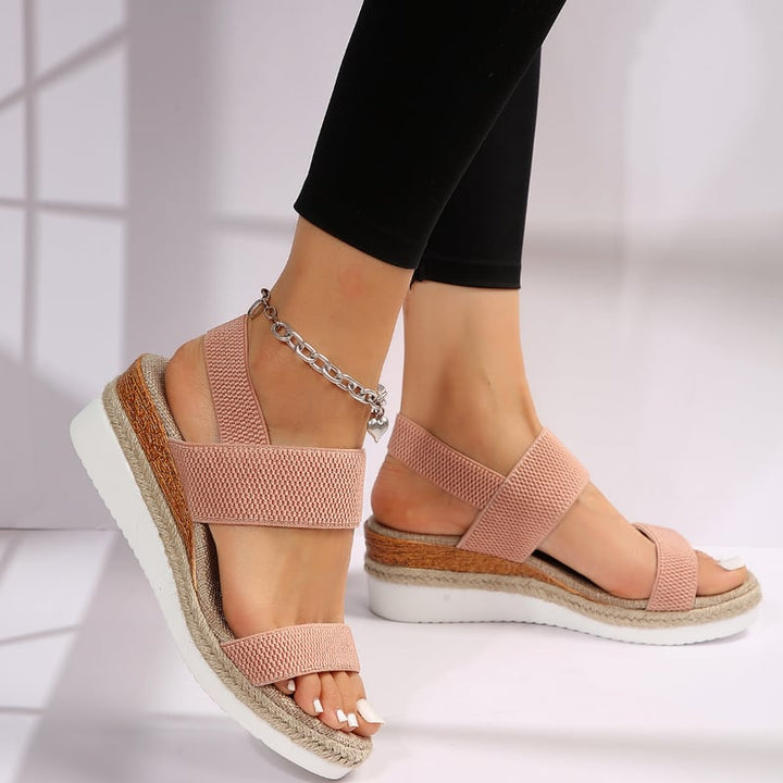 Side angle of Marigold sandal in blue showcasing lightweight sole and strap silhouette