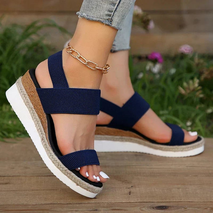 All five color options of the Marigold orthopedic sandal — brown, pink, black, blue, and gray