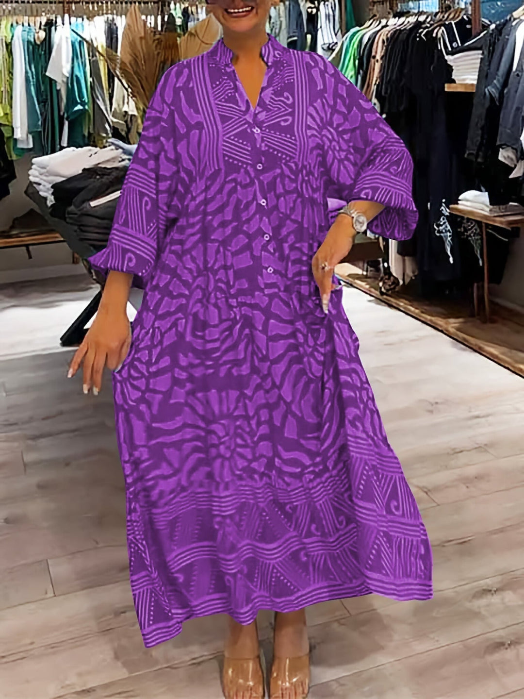 Flat lay of the Marigold V-neck flowy dress showing color and print detail