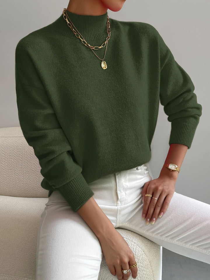 Beige turtleneck sweater on a model, perfect for layering or wearing solo in cooler weather