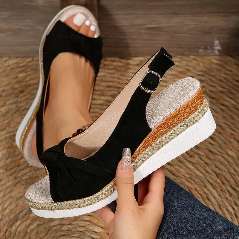 Marinette women's adjustable sandals in beige shown from a three-quarter angle on a clean background