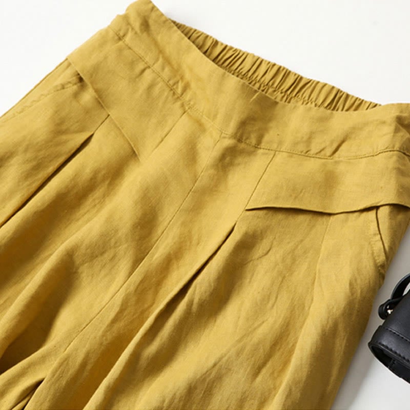 Close-up of wide-leg relaxed pants showing soft fabric drape and side pocket detail