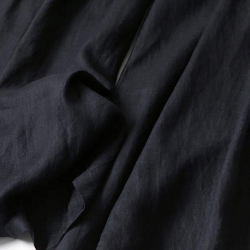 Side view of white wide-leg relaxed pants showing open leg cut