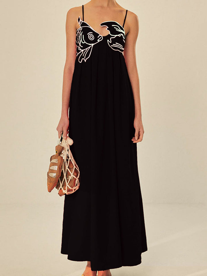 Close-up of the embroidered graphic bust detail on the Marisol maxi dress in red
