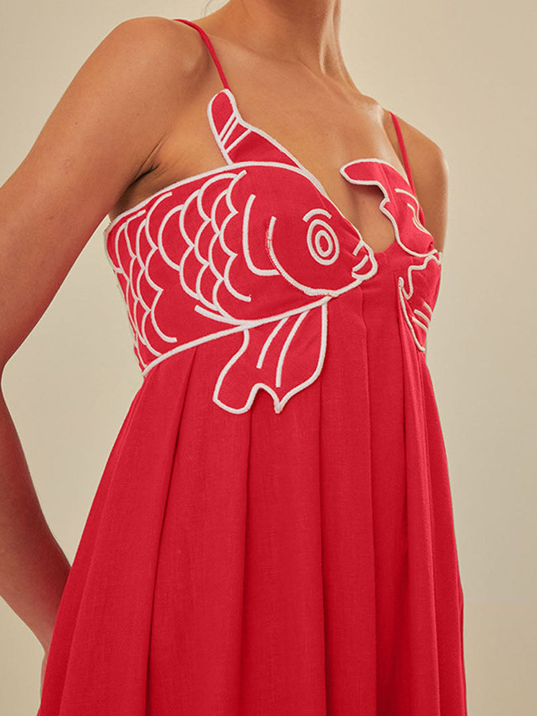 Woman in a black embroidered spaghetti strap maxi dress, front view, styled for a casual summer occasion