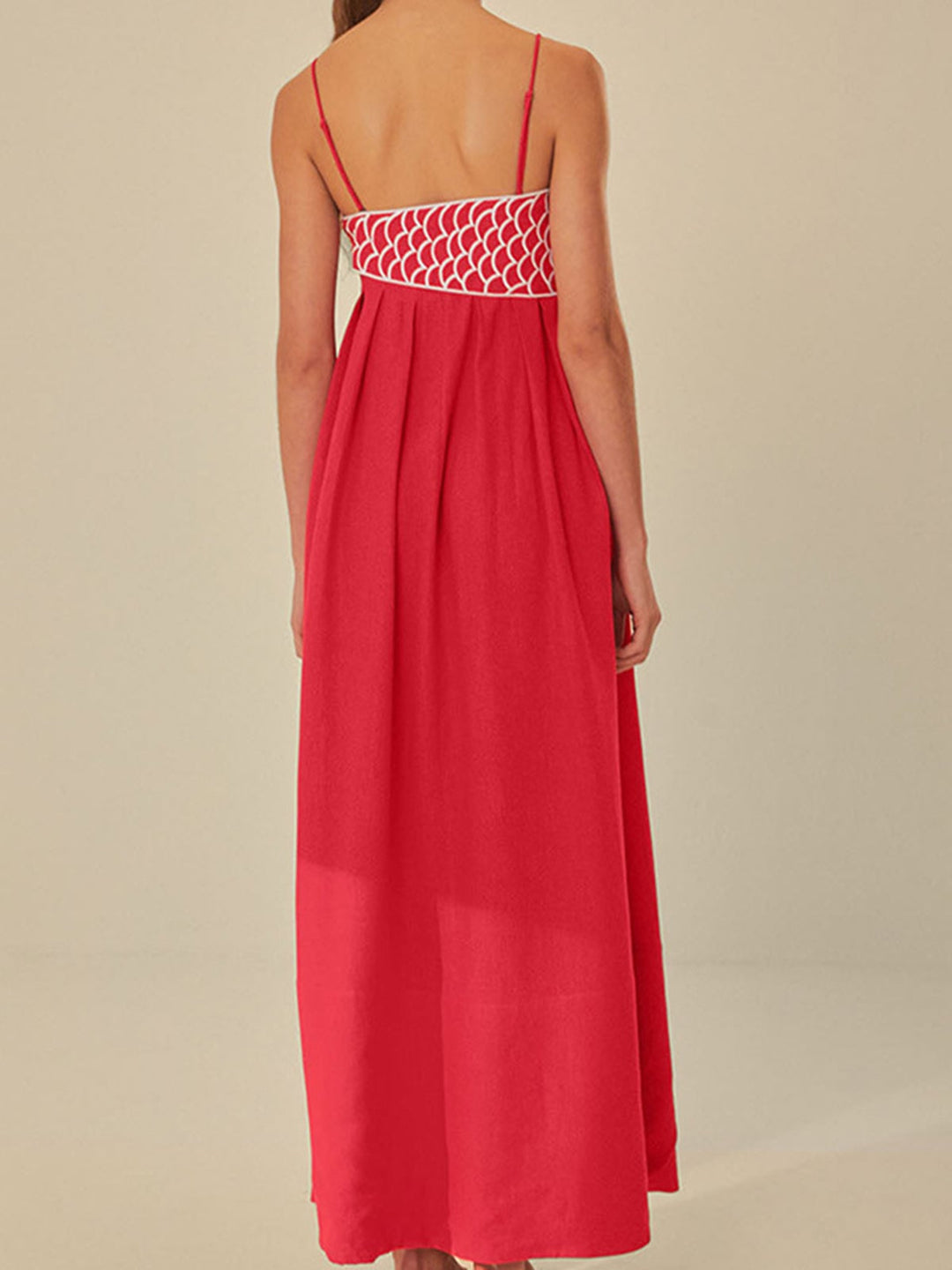 Close-up of the embroidered neckline detail on the Marisol maxi dress in black