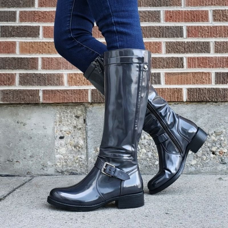 Knee-high boots in bold red colorway shown against a neutral background