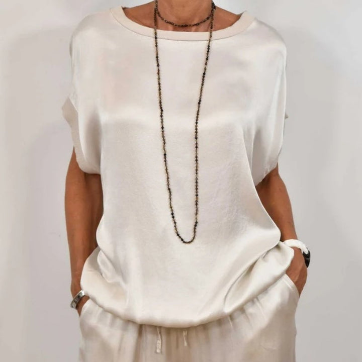 Model posing in the Marla set in camel, showcasing the relaxed fit and minimalist design
