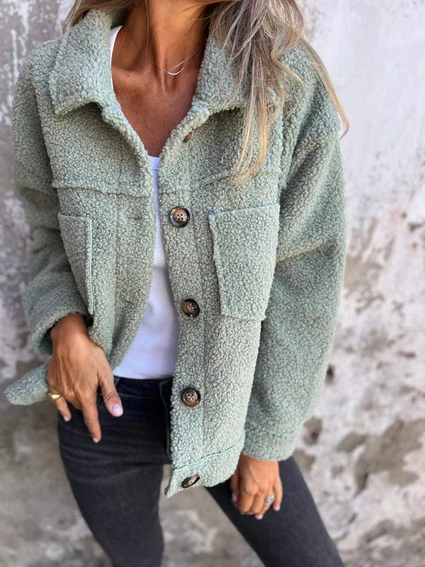 Model wearing the Marleau lapel collar jacket in sage styled over a casual outfit for an everyday fall look