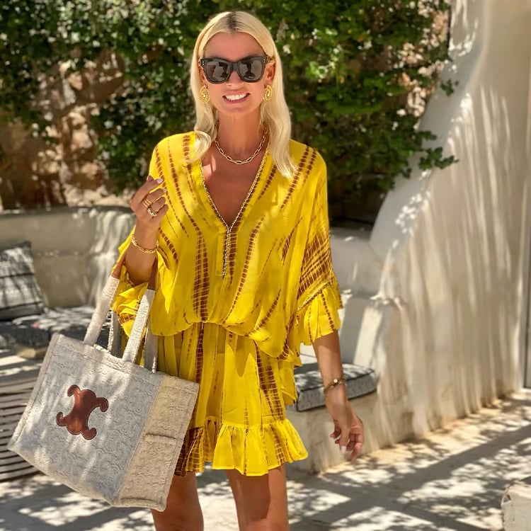 Woman wearing the Marlowe high-waist V-neck tummy control mini dress in a casual daytime setting