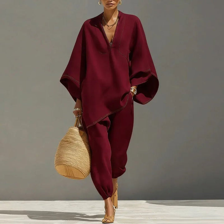 Flat lay of the Marlowe batwing sleeve two piece set in all three colors: apricot, black, and burgundy