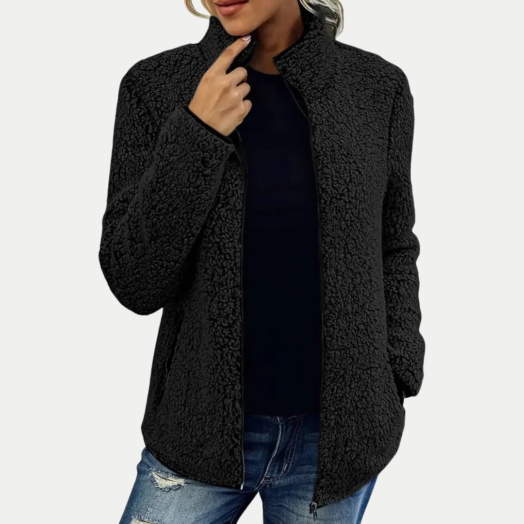 Woman in the Marsha jacket styled for an outdoor casual outing in a cool-weather setting