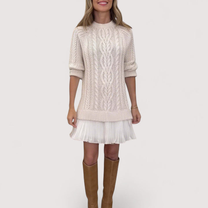 Woman wearing a chic everyday knit dress in a neutral tone, showcasing a smooth flattering silhouette