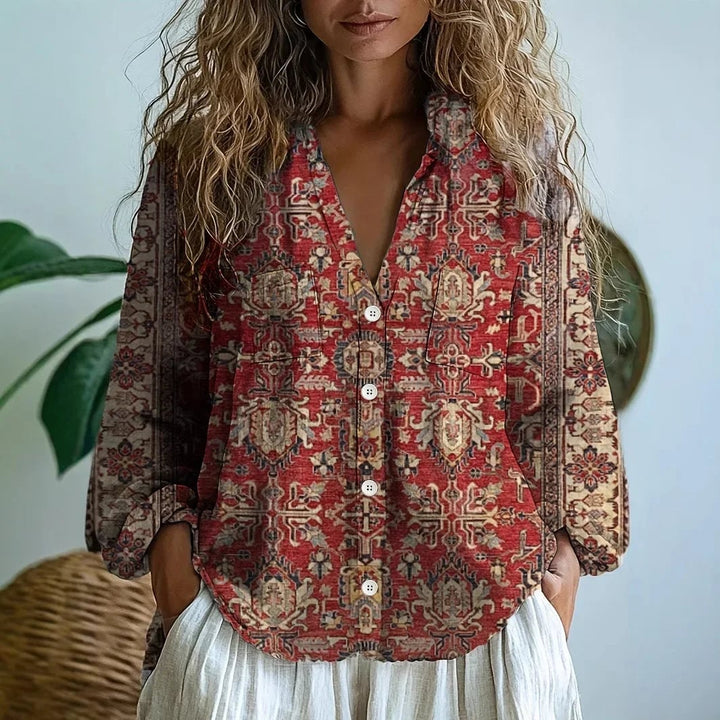 Flat lay of the Martha nature print blouse in burgundy showing full length and sleeve detail