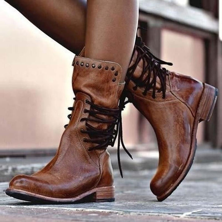 Classic comfort boot in brown with cushioned sole and timeless silhouette, shown from a front angle