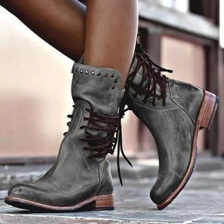 Side profile of women's classic comfort boot in grey showing the full boot silhouette and supportive design