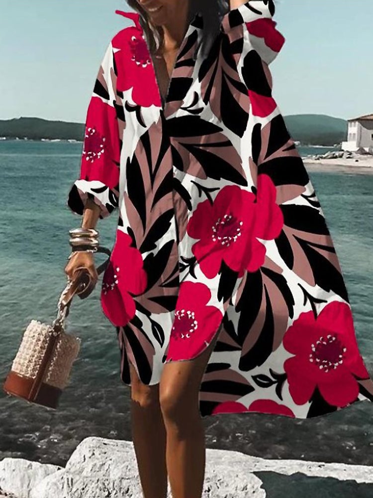 Woman wearing a red oversized midi shirt dress with a relaxed fit, styled with sandals for a summer look