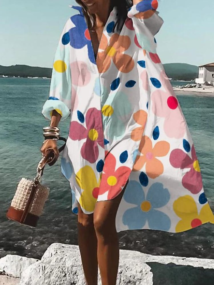Green and white printed midi shirt dress displayed on a model in a bright, airy setting