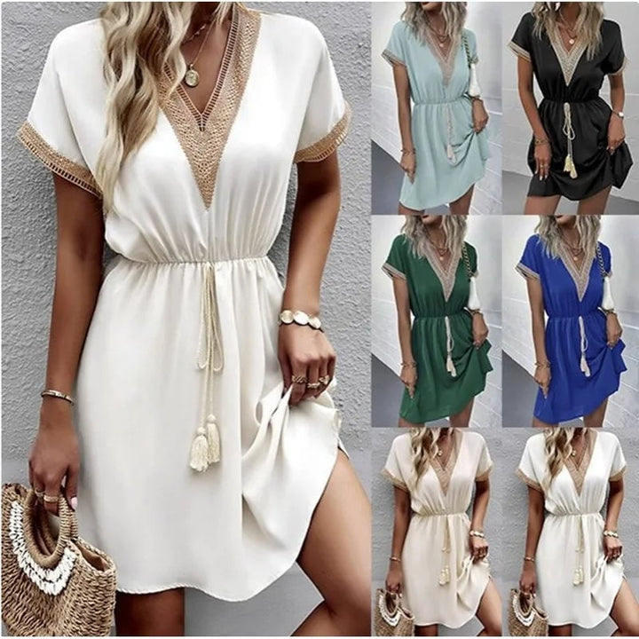 Flat lay of the Matilda boho draped dress in green showing fabric texture and waist tie detail