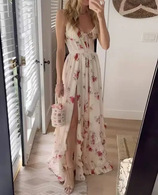 Full-length shot of model styled in the Matilda floral dress with heeled sandals and a clutch
