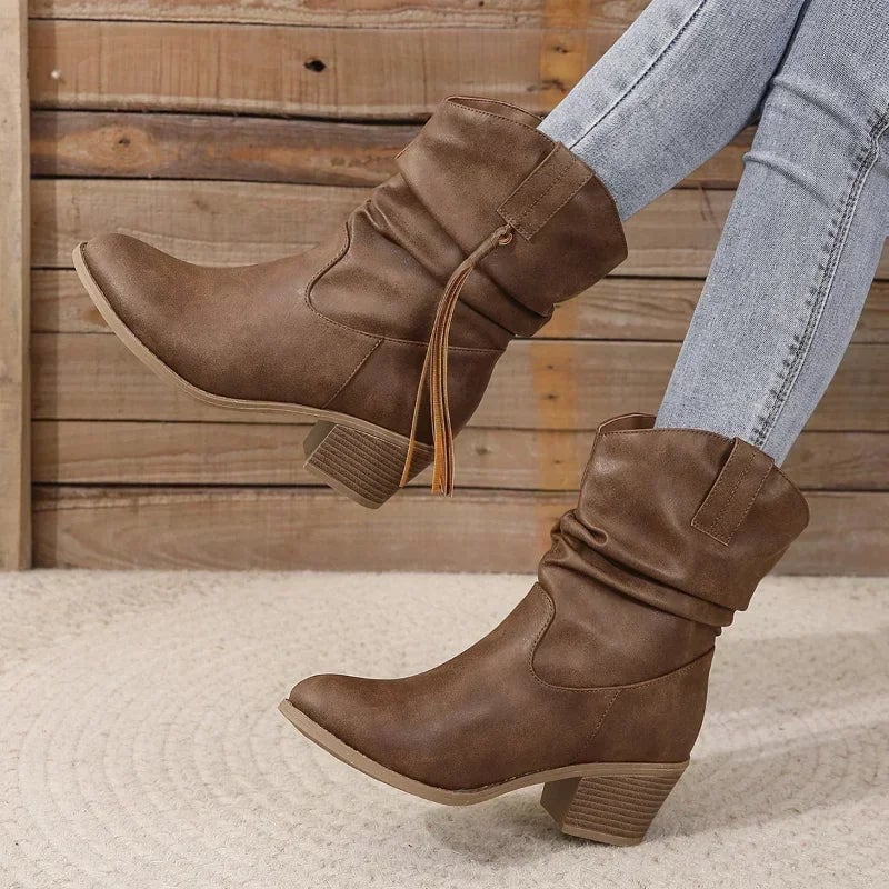 Pair of dark brown western boots displayed from above showing toe shape and stitching