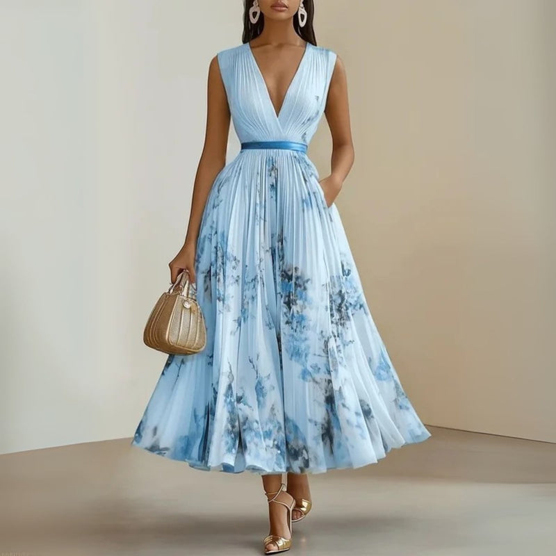 Close-up of the V-neckline and soft fabric drape on the Maureen sleeveless maxi dress in blue