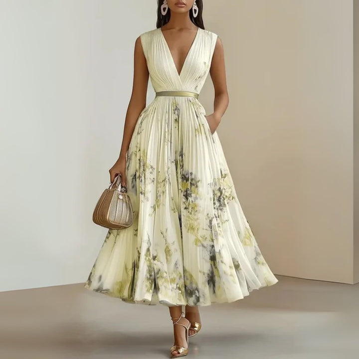 Full-length shot of woman in purple flowy maxi dress styled with strappy sandals