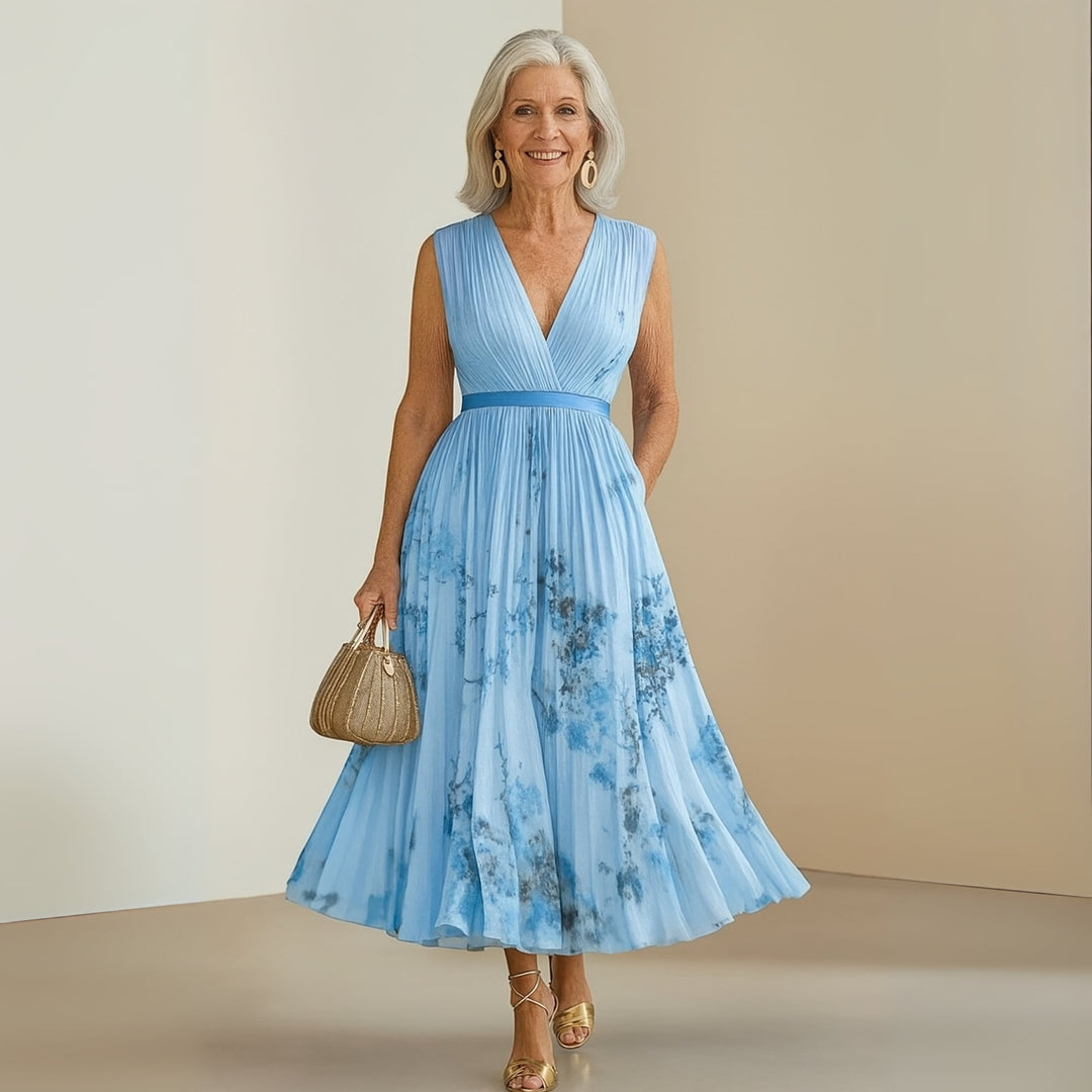 Group flat-lay of the Maureen maxi dress in all five colors: beige, pink, yellow, blue, and purple
