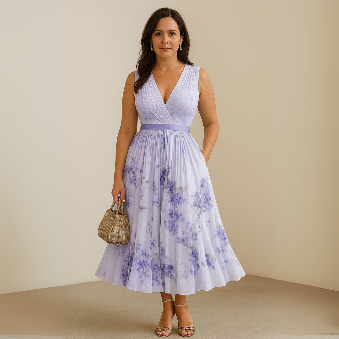 Model in beige Maureen maxi dress dressed up with heels for an evening occasion