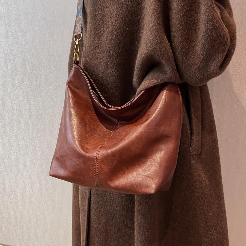 Beige classy fashion bag with spacious interior, side angle view