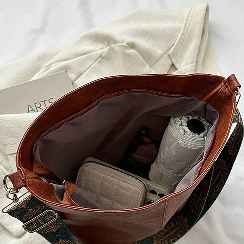 Green classy fashion bag with patterned strap, lifestyle shot
