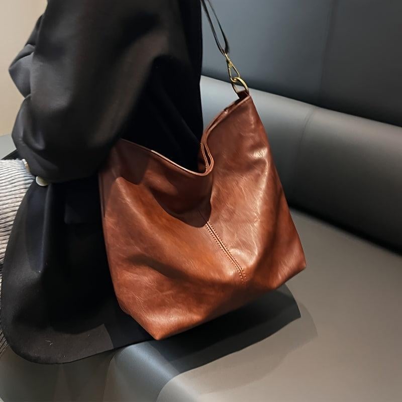 Brown fashion bag interior showing spacious compartments