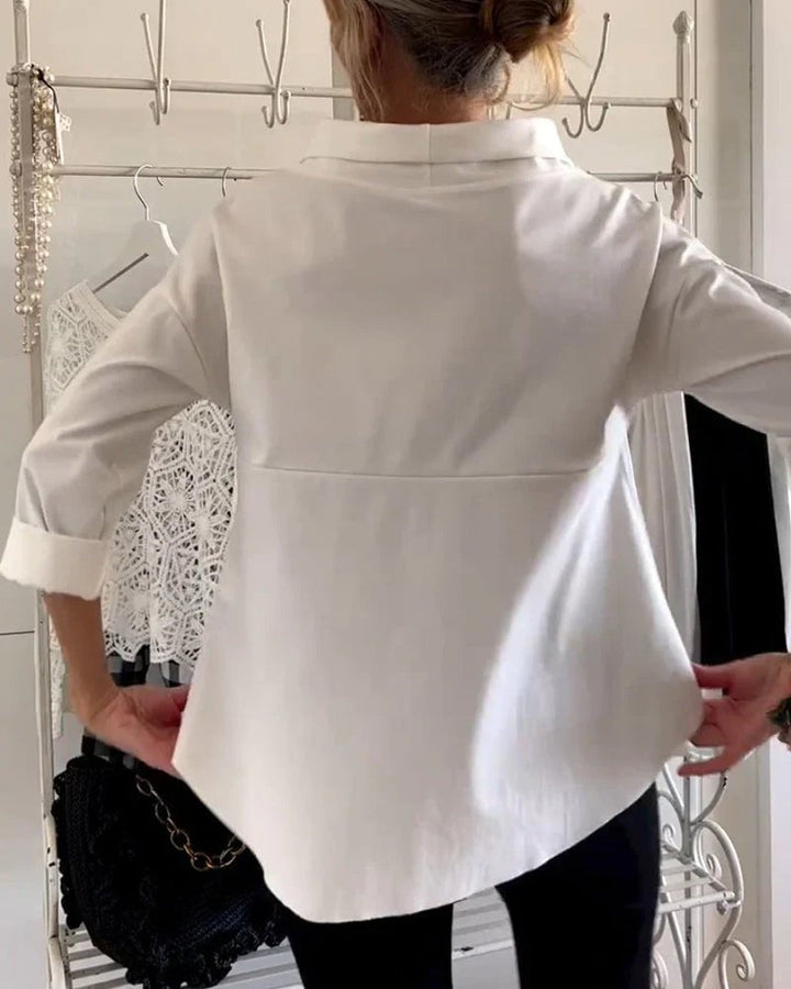 Flat lay of the women's bateau neck top in white, blue, and black colorways