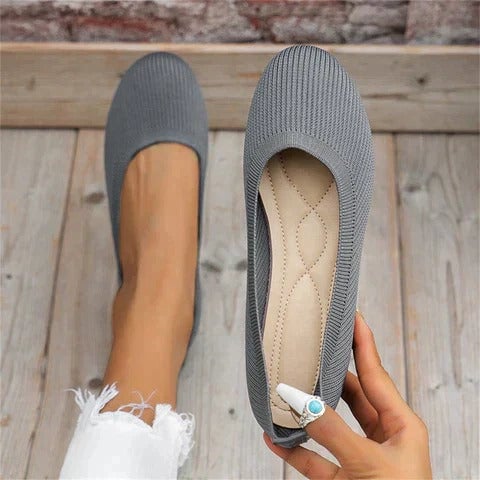 Maya knit ballet flat in black displayed from the side to show the slim low-profile sole