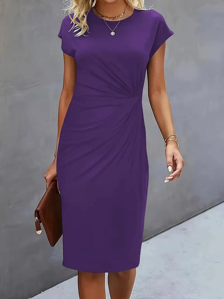 Back view of the Maya ruched midi dress in black