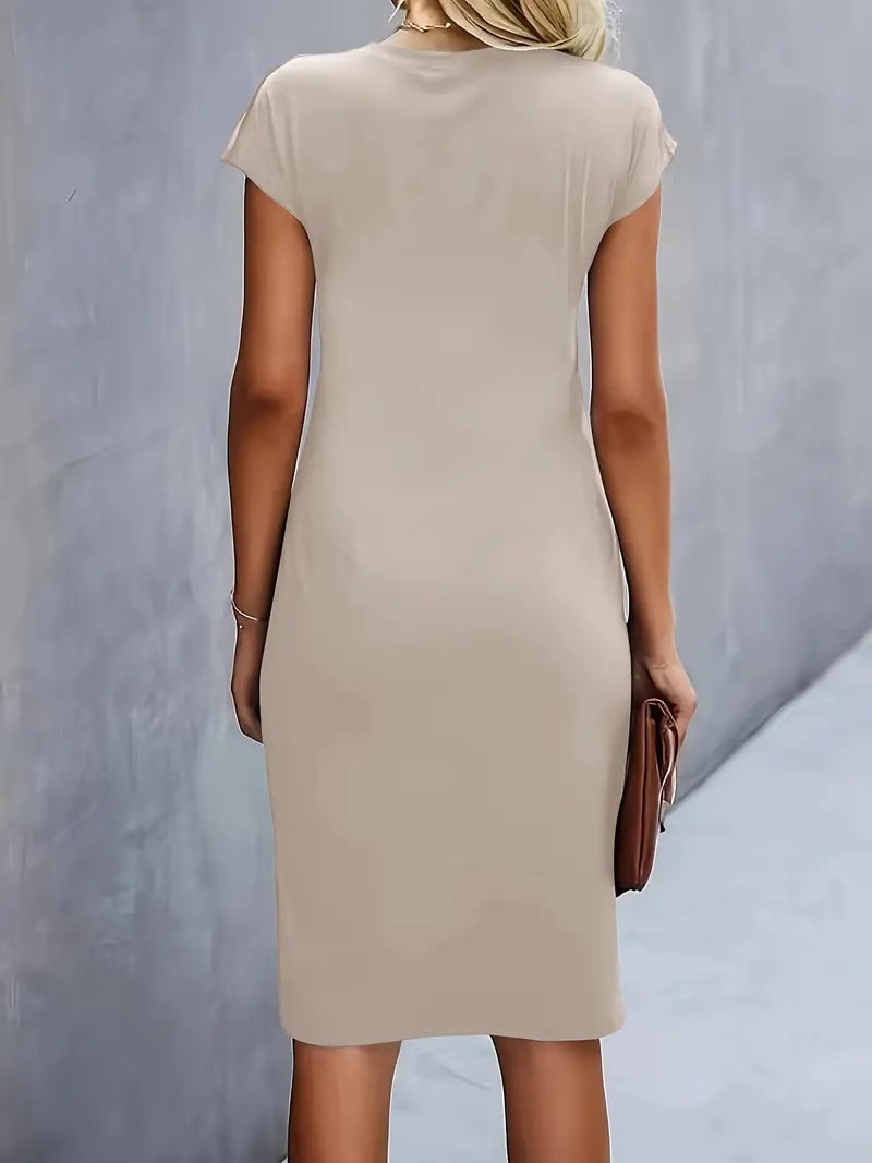 Side profile of the Maya midi dress in dark green showing the midi hem length