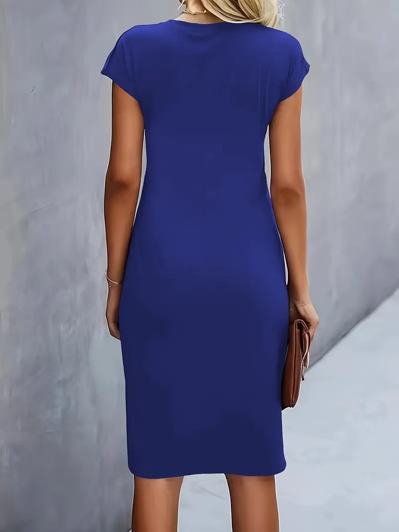 Close-up of the ruched waist detail on the Maya midi dress in navy blue