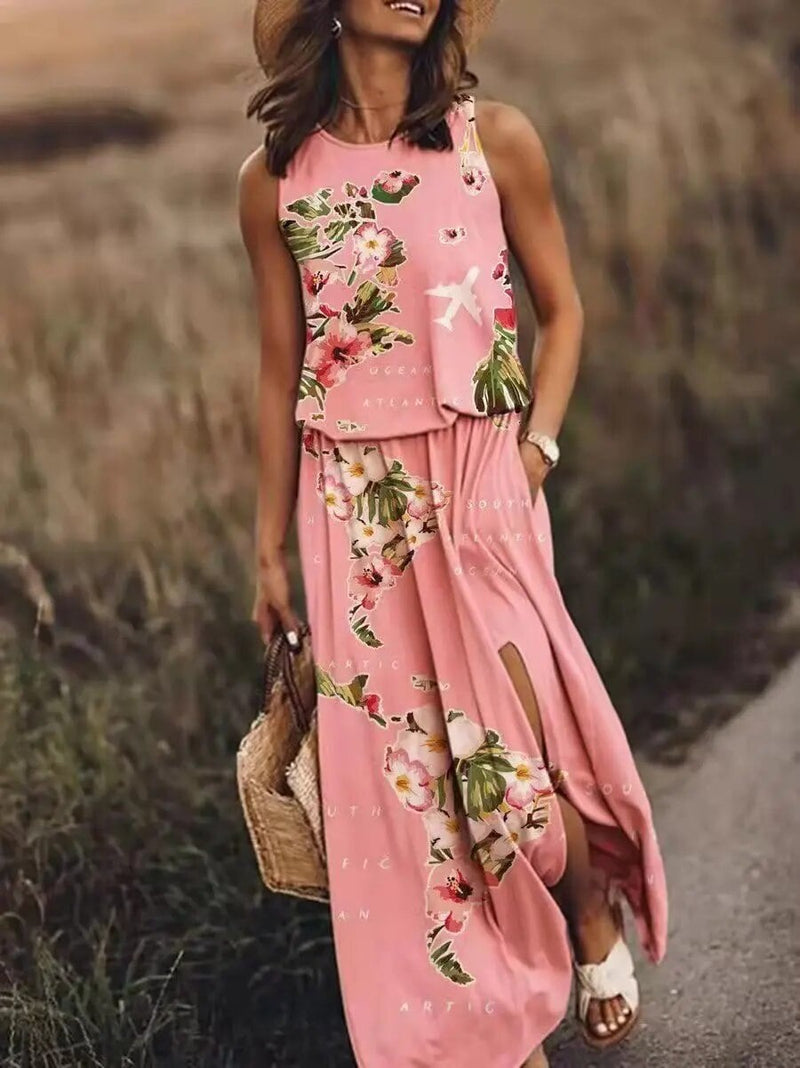 Woman wearing the Maya sleeveless boho maxi dress with elastic waist in pink, full-length front view