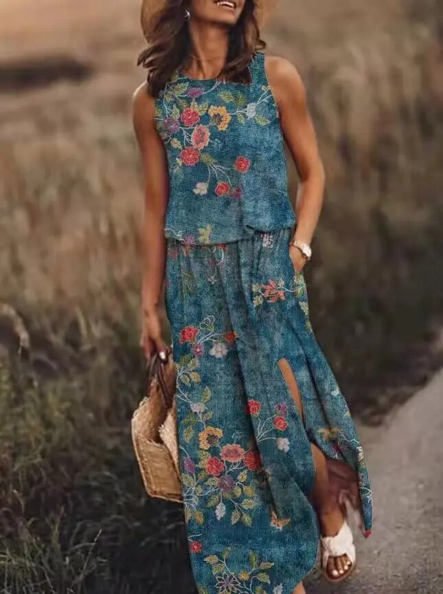 Back view of the Maya sleeveless maxi dress in light blue, highlighting the clean neckline and drape