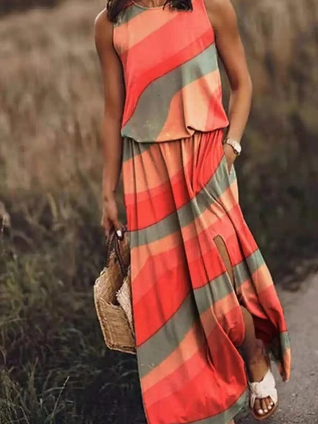 Woman in the Maya boho maxi dress in orange, full-length lifestyle shot in natural light