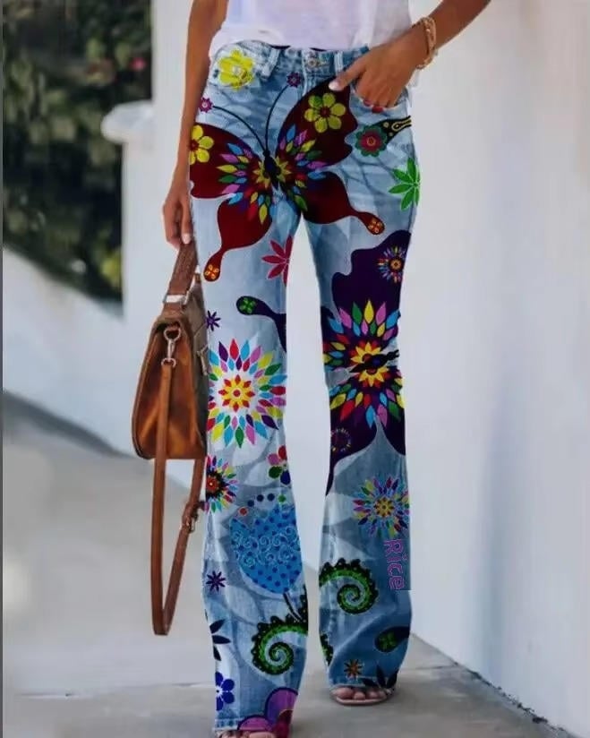 Full-length front view of model wearing floral flare jeans styled with a white tee