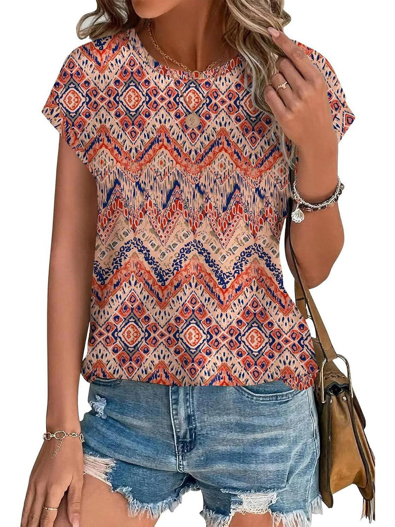 Close-up of watercolor botanical leaf print detail on a women's casual cap sleeve top