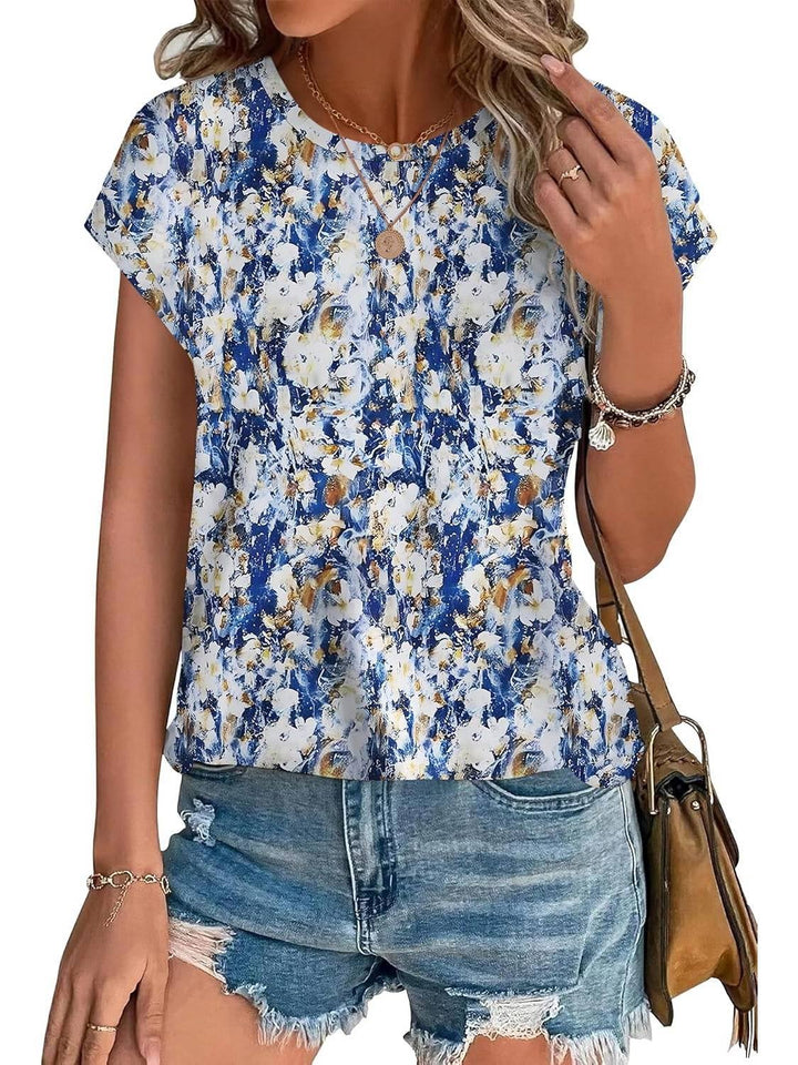 Side view of women's leaf print curved hem cap sleeve top showing relaxed silhouette